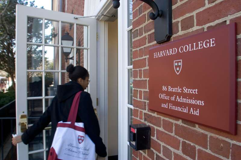 A student enters the Harvard College Office of Admissions and Financial Aid in Cambridge, Massachusetts on March 29, 2007.