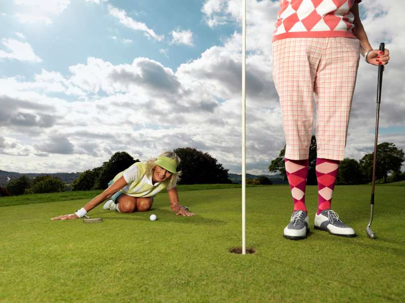Mature ladies playing golf