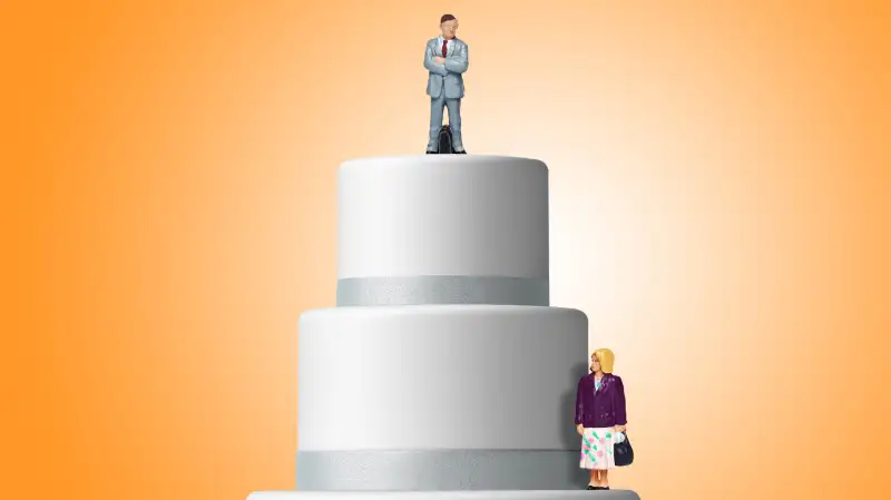 cake with businessman on top tier and businesswoman on lower tier