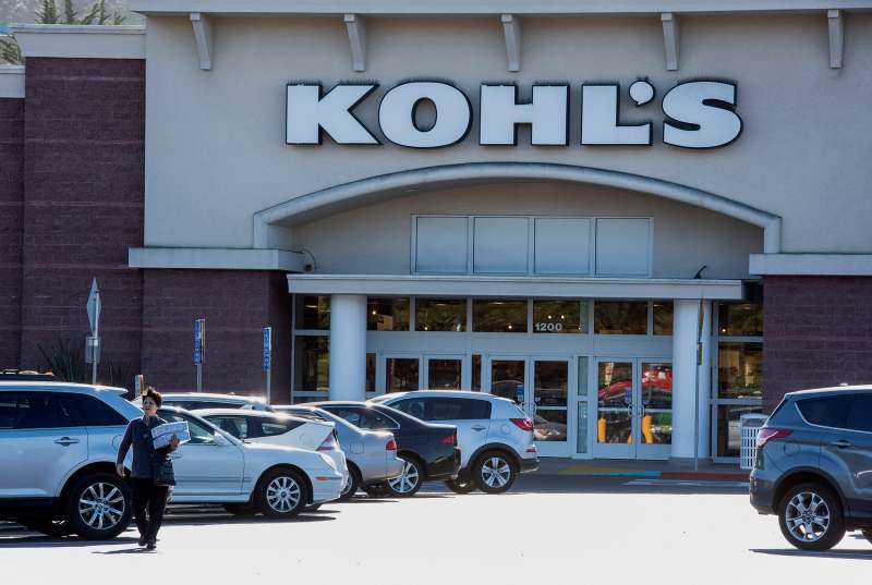 A pedestrian walks in front of a Kohl's Corp. store in Colma, California, on February 24, 2015.