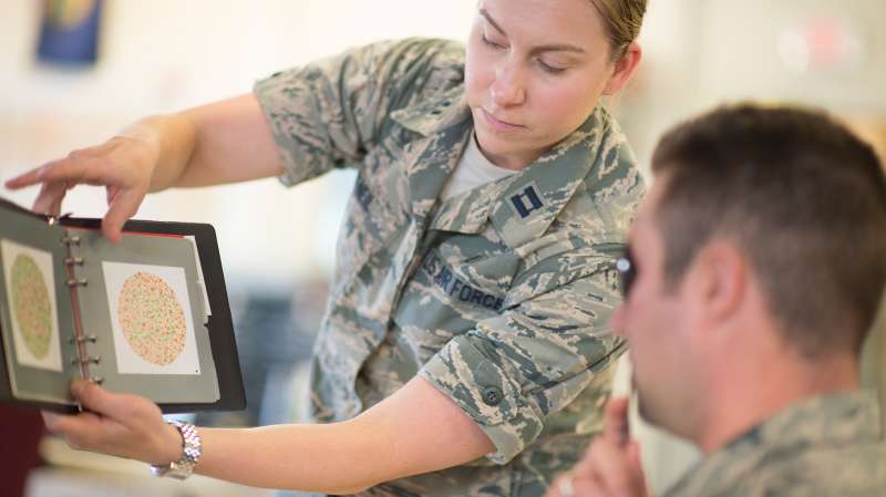 U.S. Air Force Capt. Marcy O'Neil, from the 158th Fighter Wing Medical Squadron, administers a vision exam at the Vermont Air National Guard in South Burlington, Vermont, June 6. The 158th Medical Squadron has become the first Air Guard base to process both Preventative Health Assessments and Occupational Health Physical Examinations in one large push, improving the medical experience for both sides, and creating a cost-saving and efficient format for other bases to emulate.