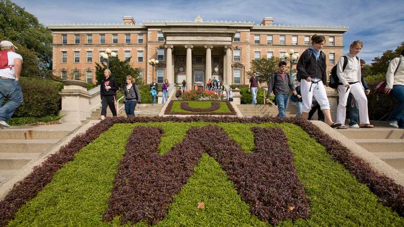 Students make their way between classes on the steps of Agricultural Hall at the University of Wisconsin-Madsion on October 17, 2007.