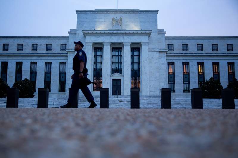 A Federal Reserve police officer walks past the Marriner S. Eccles Federal Reserve building in Washington, D.C., on September 2, 2015.