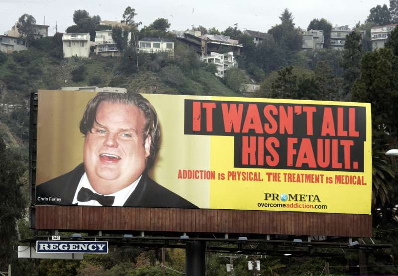 A billboard uses a photograph of the late comedian Chris Farley to advertise a treatment for drug and alcohol addiction, on Sunset Boulevard in Los Angeles, April 3, 2006. The outdoor advertisement which promotes a new addiction treatment from Hythiam Inc. is the first major commercial use of Farley's image approved by his family. Farley died of a drug overdose.
