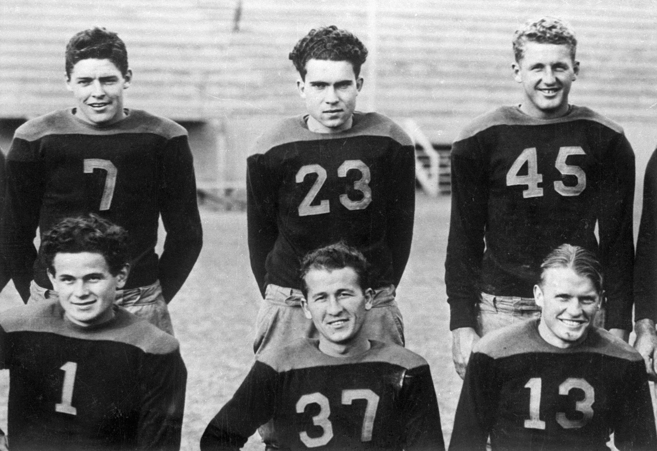 Richard Nixon stands in a numbered uniform (#23) with fellow football players during his senior year at Whittier College, January 1, 1934.
