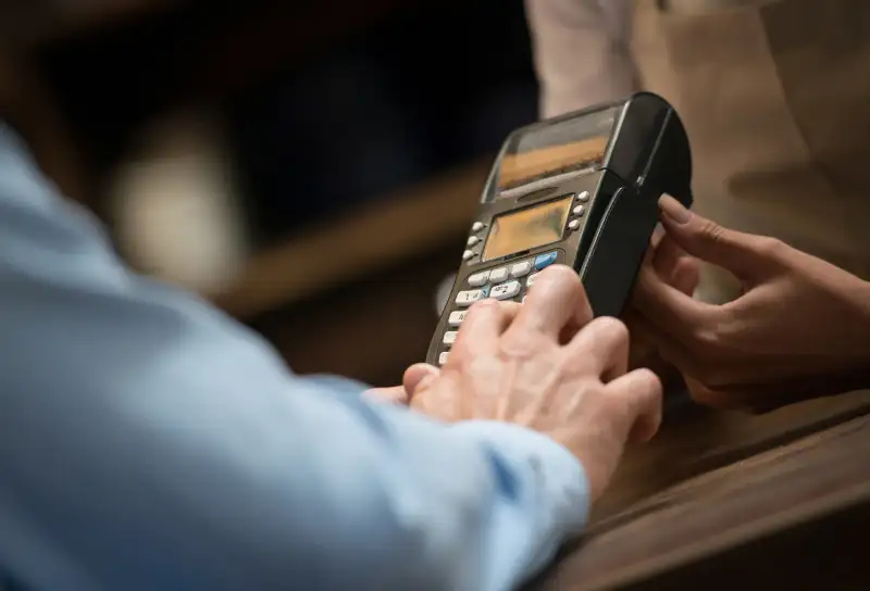 entering info in credit card reader at point of sale