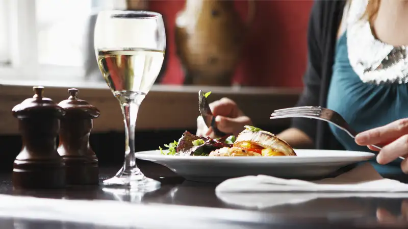 woman eating alone in restaurant