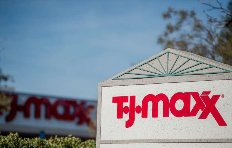 A TJ Maxx sign is displayed outside a TJX Companies Inc. store in Pleasant Hill, California, U.S., on Thursday, Feb. 26, 2015. TTJX Cos., the owner of discount retailers T.J. Maxx and Marshalls, is raising its worker pay to at least $9 an hour this year, a sign that the retail industry is responding to a similar wage hike announced last week by Wal-Mart Stores Inc. Photographer: David Paul Morris/Bloomberg