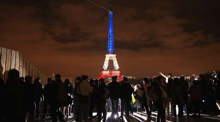 The Eiffel Tower is illuminated in Red, White and Blue in honor of the victims of Friday's terrorist attacks