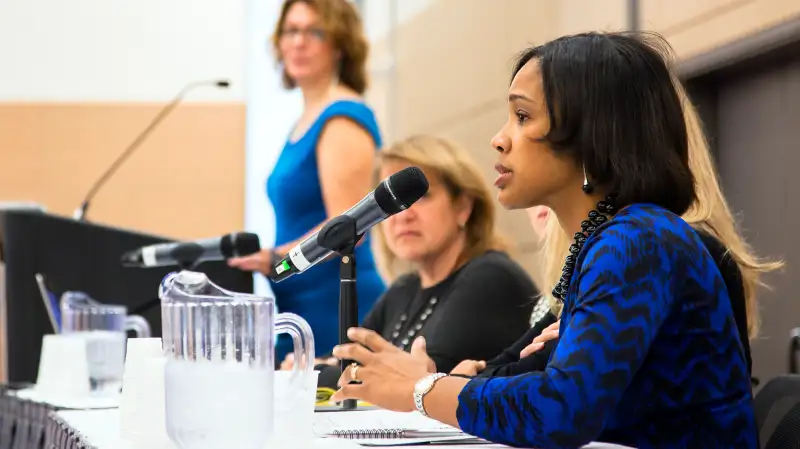 Lazetta Rainey Braxton addresses FPA attendees. Also pictured: Rachel F. Elson, standing, and Diane Harris.