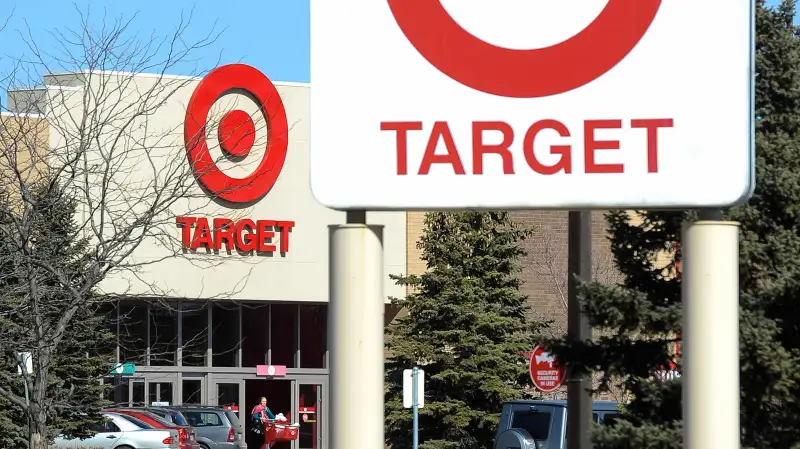 A shopper leaves a Target store in St Louis Park, Minnesota March 10, 2015.