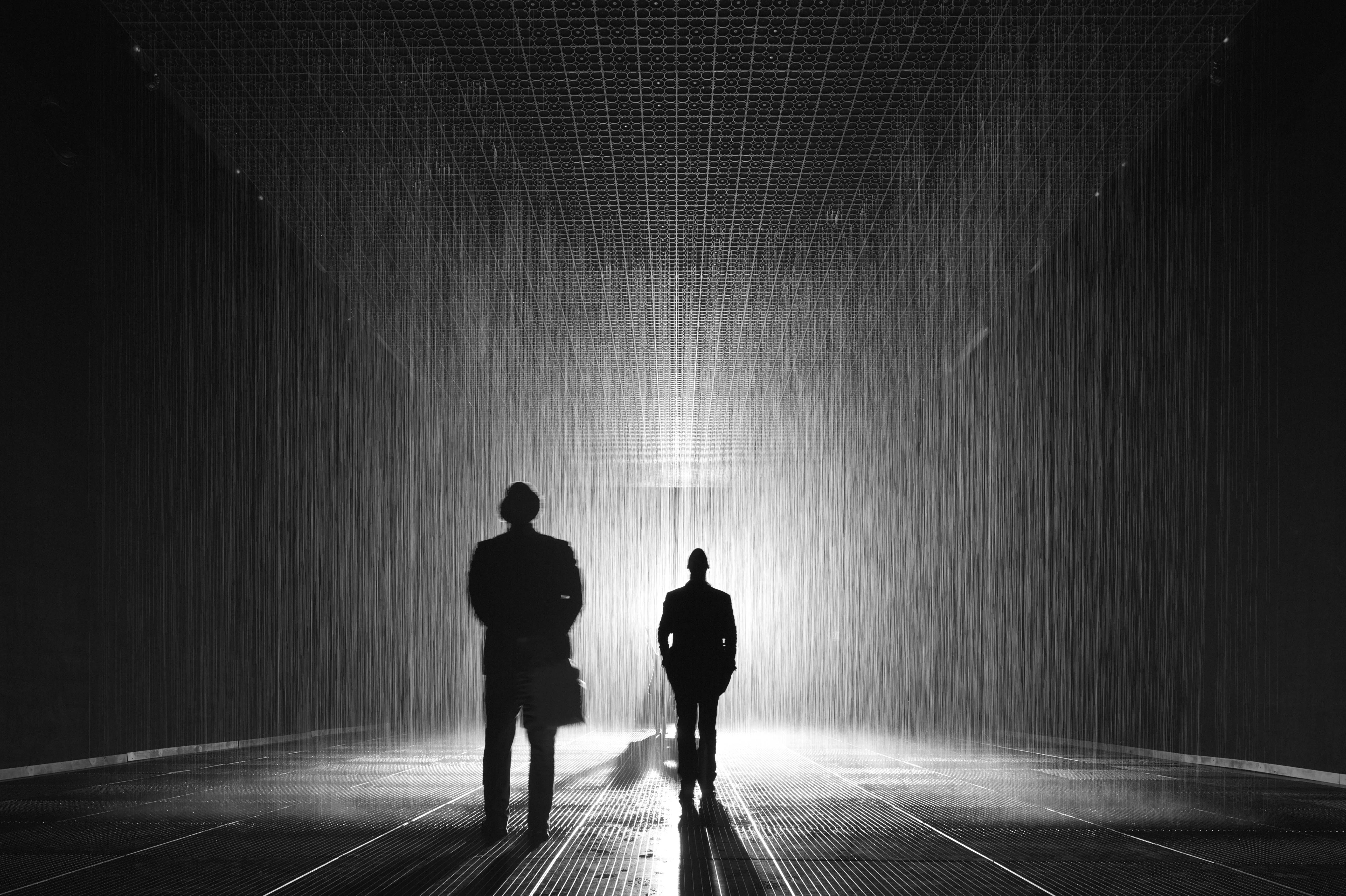 The “Rain Room” at The Los Angeles County Museum of Art (LACMA), on view November 1, 2015–March 6, 2016, an immersive work by the London-based artist collective Random International. Within this large-scale installation, water falls continuously to create a cacophonous interior downpour that pauses wherever a human body is detected.