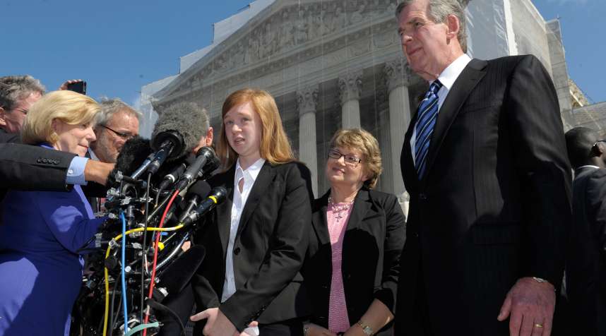 Abigail Fisher, the Texan involved in the University of Texas affirmative action case, accompanied by her attorney Bert Rein, right, spoke to reporters outside the Supreme Court in Washington in October 2012.