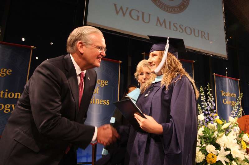 Amanda Black from Sedalia, Missouri shakes hands with Missouri Governor Jay Nixon as she becomes the first student to graduate from Western Governors University Missouri during the inaugural commencement of WGU Missouri in St. Louis on August 9, 2014. WGU Missouri is an on-line, higher education institution.