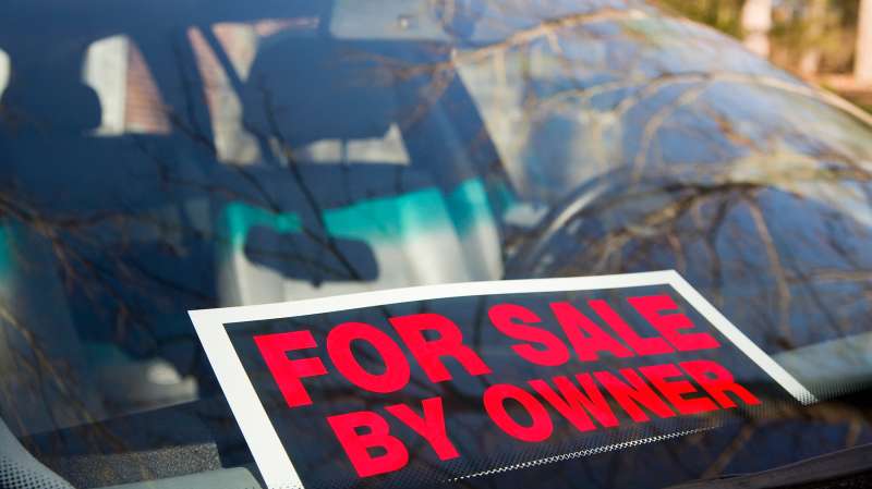 for sale by owner sign in window of car