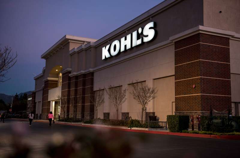 Pedestrians walk in front of a Kohl's store in Concord, California., on February 24, 2015.