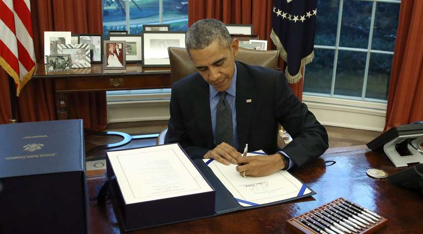 President Barack Obama signing the bill at the White House.