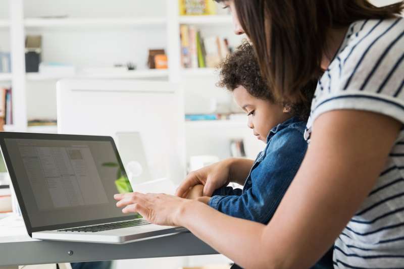 mother and daughter in front of laptop