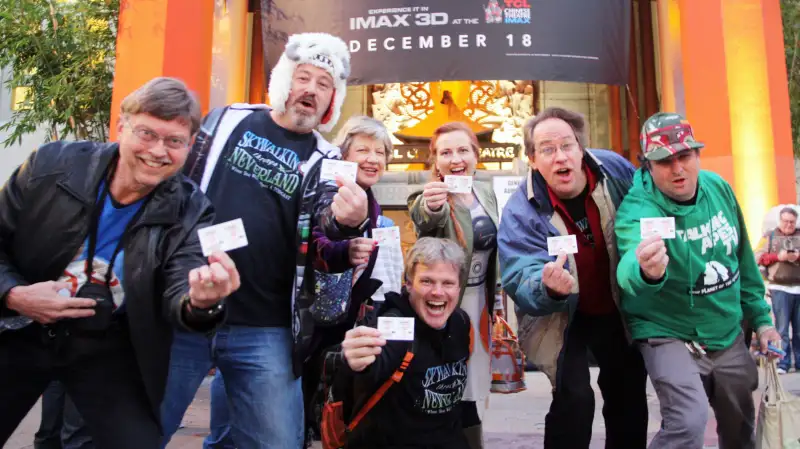 People show their tickets for the new movie in the Star Wars franchise, The Force Awakens, in front of a Hollywood movie theater in Los Angeles on Dec. 17, 2015, the release day of the film in the United States.