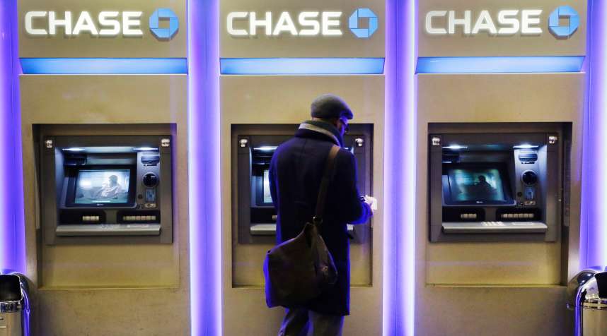 A customer uses an ATM at a branch of Chase Bank in New York.