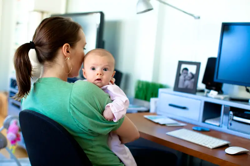 mom with baby working at home