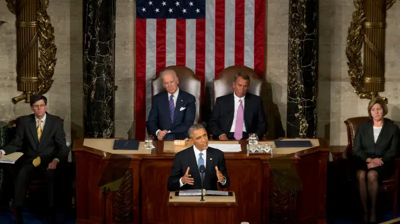 U.S. President Barack Obama, bottom, delivers the State of the Union address to a joint session of Congress as U.S. Vice President Joseph  Joe  Biden, top left, and U.S. House Speaker John Boehner, a Republican from Ohio, top right, look on at the Capitol in Washington, D.C., U.S., on January 20, 2015. Obama declared the U.S. economy healed and said the nation now must begin work to close the gap between the well-off and the wanting.