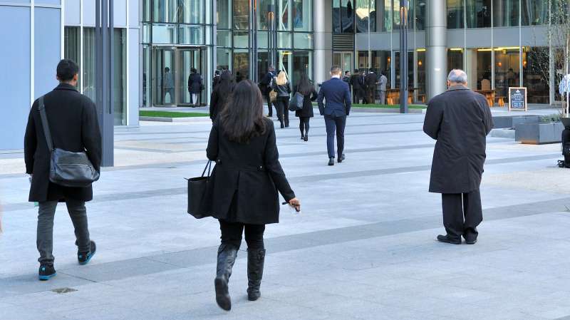 woman walking into office building