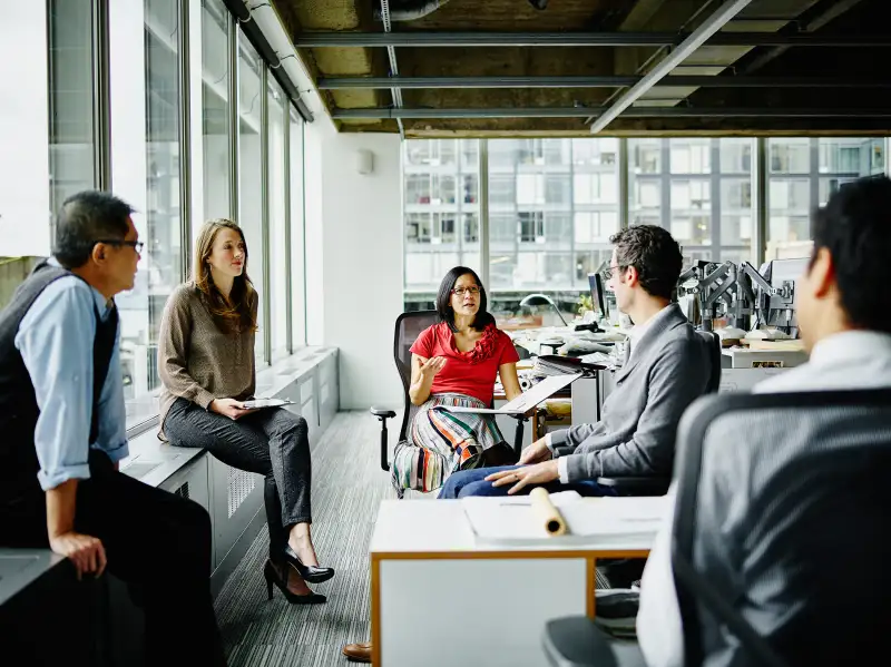 woman leading office meeting