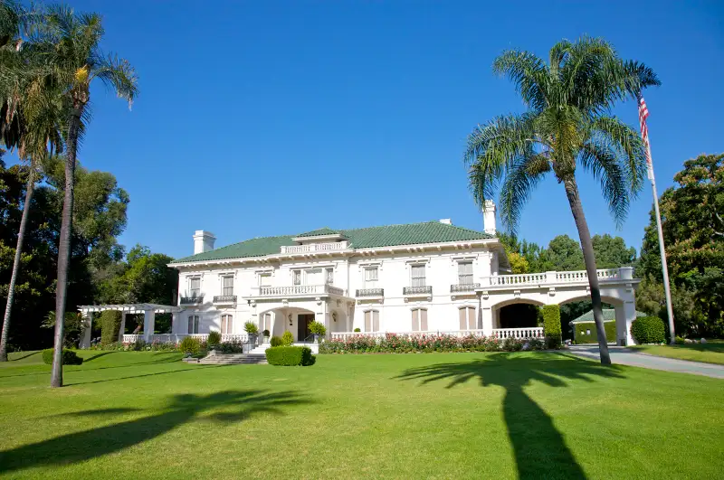 mansion with palm trees