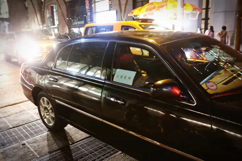 An Uber taxi navigates the streets of New York City, August 29, 2015.