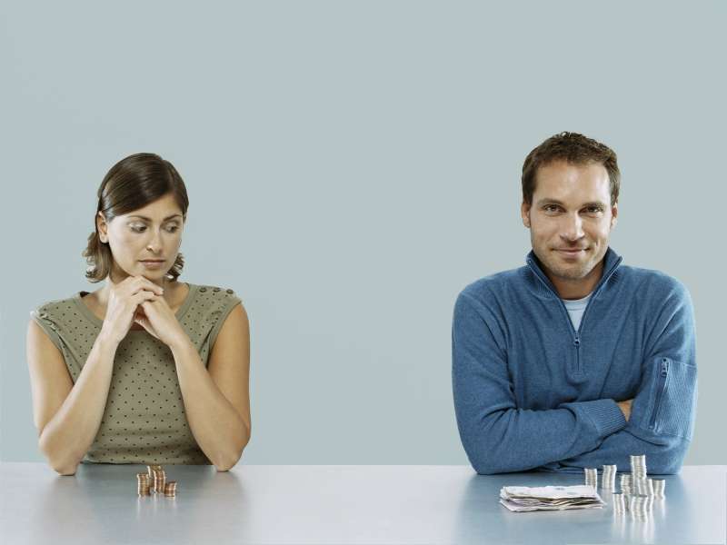 Man and Woman with money piles