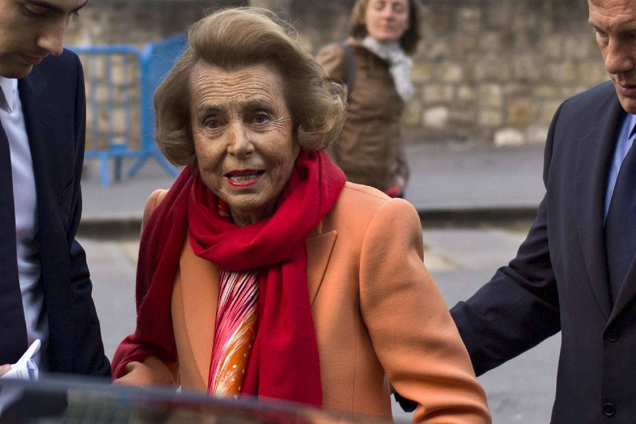 L'Oreal heiress Liliane Bettencourt, center, and her grandson Jean-Victor Meyers, second from left, leave the L'Oreal-UNESCO prize for the women in science, in Paris, March 29, 2012.