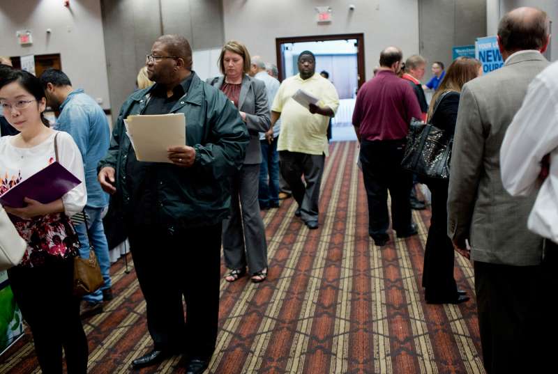 Job seekers attend a Job Fair Giant career fair in Sterling Heights, Michigan, on September 30, 2015.