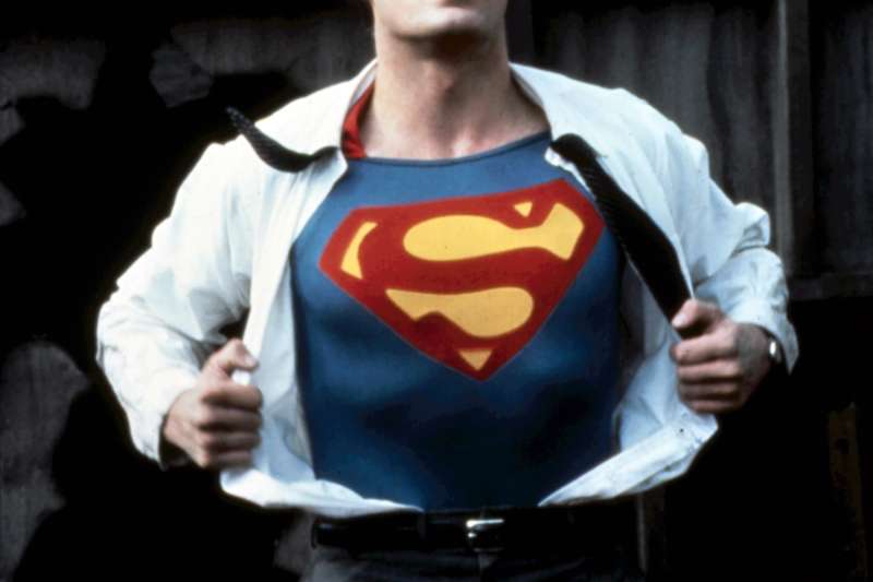 Christopher Reeve unveiling Superman costume under work clothes