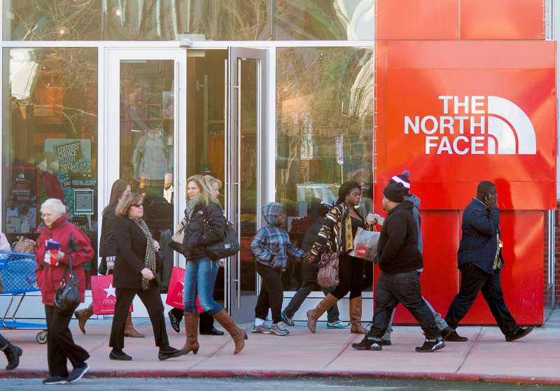 Shoppers walk the North Face at the Easton Towne Center in Columbus, Ohio, November 29, 2013.