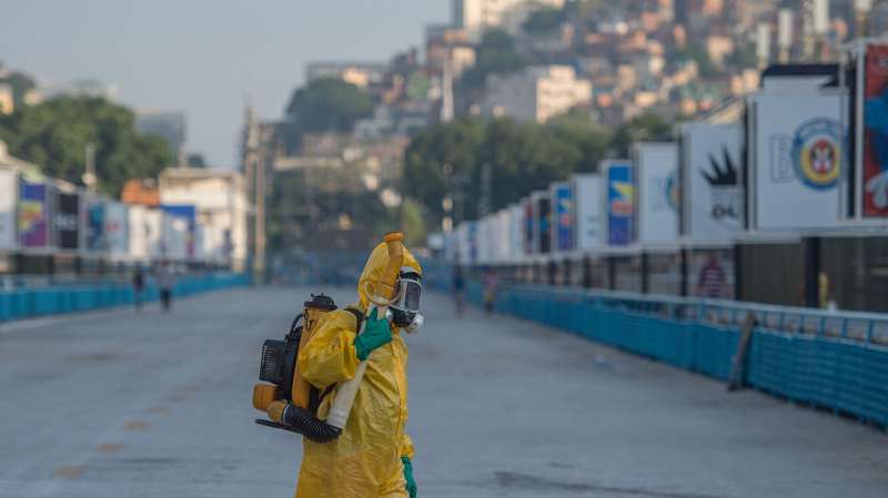 A municipal agent sprays anti Zika mosquitos chimical product at the sambadrome in Rio de Janeiro, on January 26, 2016. Brazil is mobilizing more than 200,000 troops to go  house to house  in the battle against Zika-carrying mosquitoes, blamed for causing horrific birth defects in a major regional health scare, a report said Monday.
