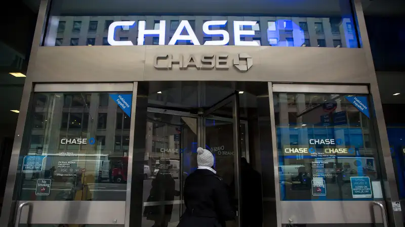 Customers enter a JPMorgan Chase bank branch in New York, on January 12, 2016.