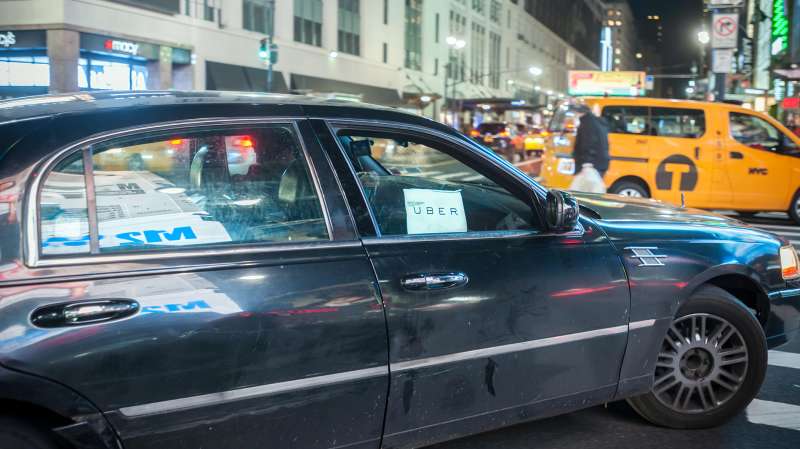 An Uber livery travels through Midtown Manhattan in New York on January 12, 2016.