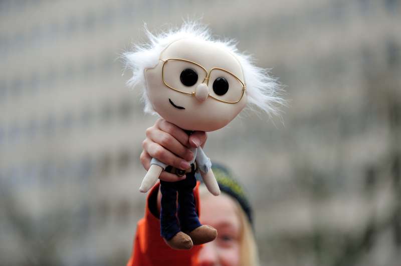 Oliver Konink holds a Bernie doll during a rally in Pioneer Courthouse Square, Portland, Ore., on January 23, 2016, to show support for Democratic presidential candidate Bernie Sanders ahead of the first primary caucus.