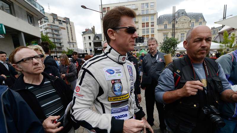 Scott Tucker of the United States and driver of the #33 Level 5 Motorsports HPD Honda during scrutineering for the 80th running of the Le Mans 24 Hour race at Place de La Republique on June 11, 2012 in Le Mans, France.