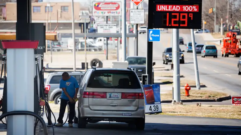 A motorist fills his car with gas February 12, 2016 in Oklahoma City, Oklahoma. Earlier this week prices were cheaper but most gas stations in Oklahoma City were posting higher gas prices today. Prices are expected to start inching upward as spring approaches and refiners begin to throttle back on production to combat oversupply at the same time that demand begins to rise.