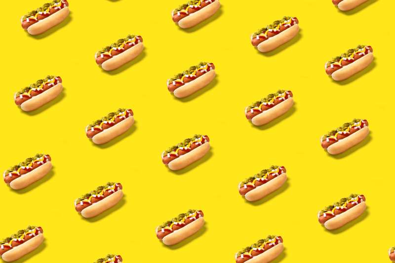 Hot dogs on yellow background