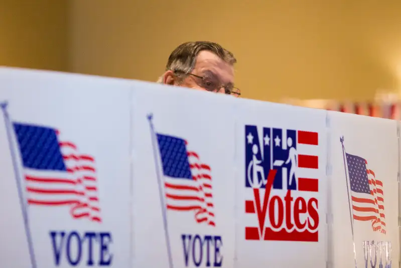 NASHUA, NH - FEBRUARY 9:  A voter casts their ballot at a polli