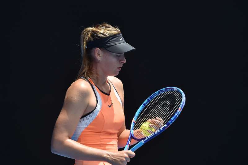 Russia's Maria Sharapova prepares to serve during her women's singles match against Serena Williams of the US on day nine of the 2016 Australian Open tennis tournament in Melbourne on January 26, 2016.