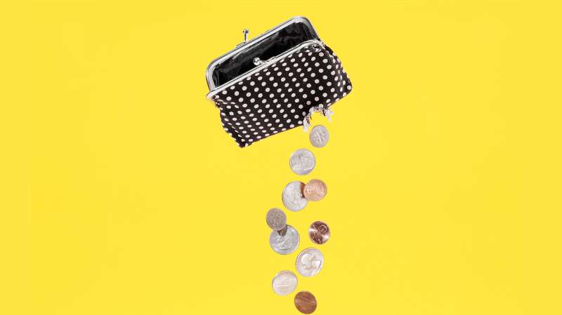 coin purse with hole leaking money