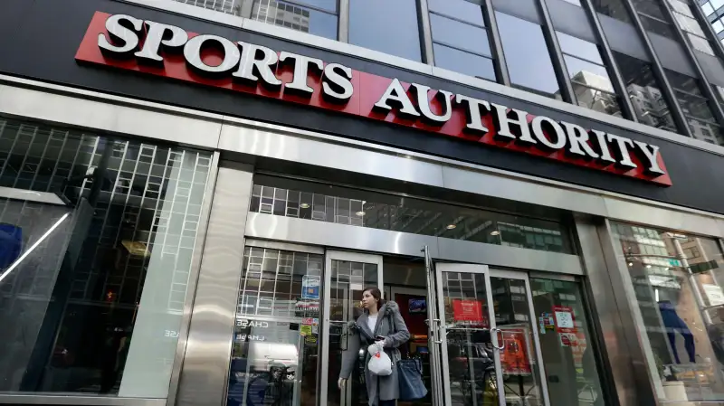 A woman leaves a Sports Authority store, in New York, Wednesday, March 2, 2016. Sports Authority is filing for Chapter 11 bankruptcy protection. The Englewood, Colo., company has 463 stores in 41 states and Puerto Rico.