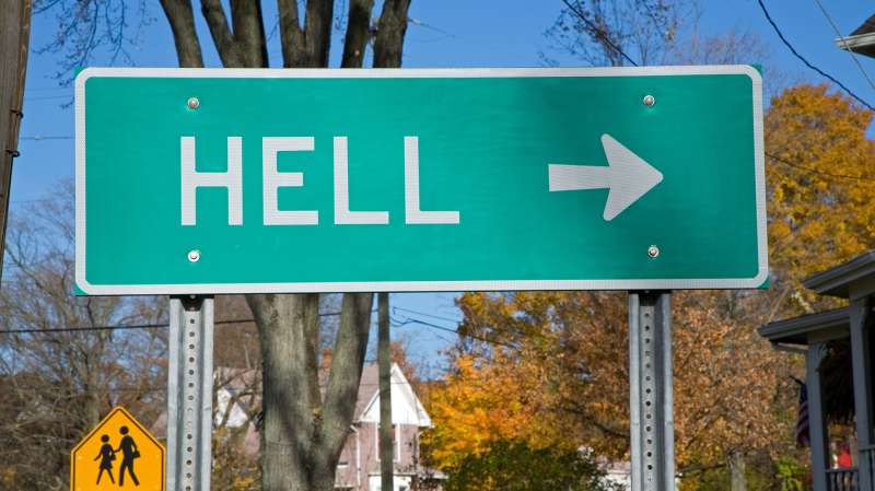 A road sign points towards the small town of Hell, Michigan
