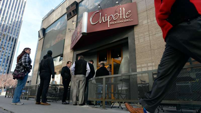 Patrons of Chipotle restaurant at 1600 California in Denver line up for lunch January 06, 2015.