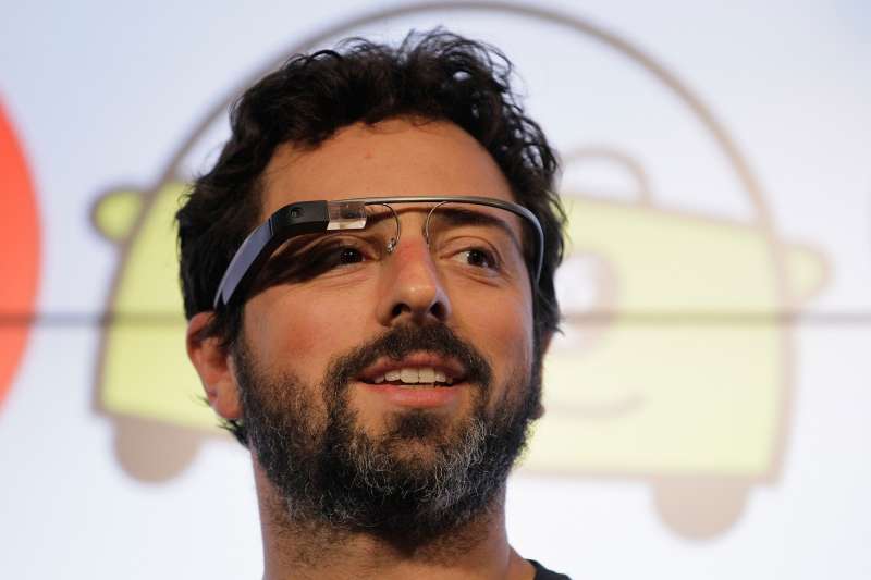 Google co-founder Sergey Brin stands on stage during a bill signing by California Gov. Edmund G. Brown Jr., for driverless cars at Google headquarters in Mountain View, California, September 25, 2012.