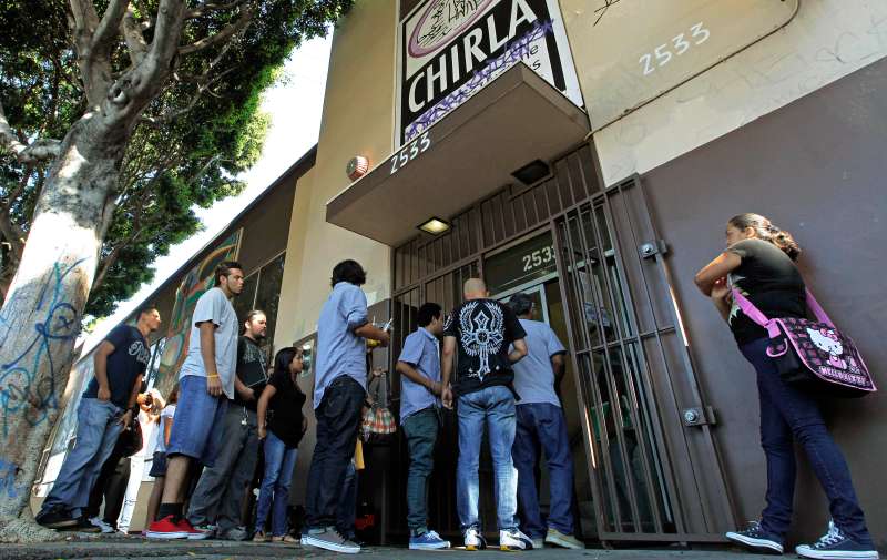People line up for an orientation seminar for illegal immigrants, to determine if they qualify for temporary work permits, at the Coalition for Humane Immigrant Rights of Los Angeles (CHIRLA), in Los Angeles, September 20, 2012. Schools and consulates have been flooded with requests for documents since President Barack Obama’s administration said many young illegal immigrants may be eligible for two-year renewable work permits. The new policy has left schools and consulates scrambling for quick fixes ranging from new online forms, reassigned workers and extended hours.